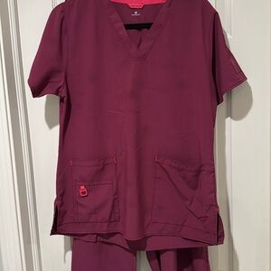Carhartt wine color scrub set, medium tall pants and medium top.